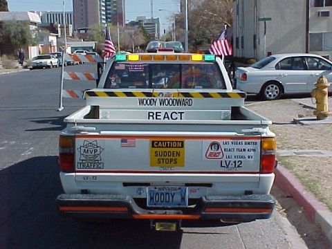 1998 Ford Crown Victoria - This truck has "WOODY WOODWARD REACT" written on the tailgate and "CAUTION SUDDEN STOPS" on a sticker.