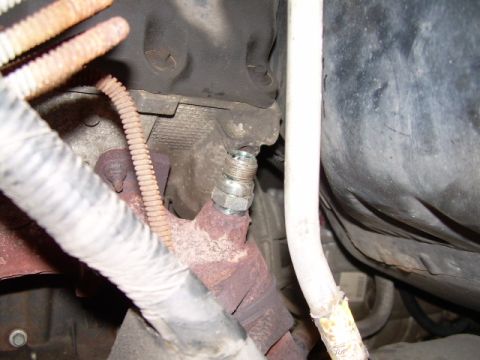 1997 Ford F-150 - Close-up view of the EGR air tube connection to the engine block, showing a metal fitting.