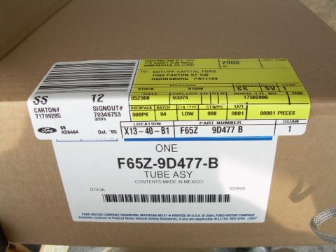 1997 Ford F-150 - A cardboard box contains a Ford F-65Z-9D477-B Tube Assy, with contents made in Mexico.