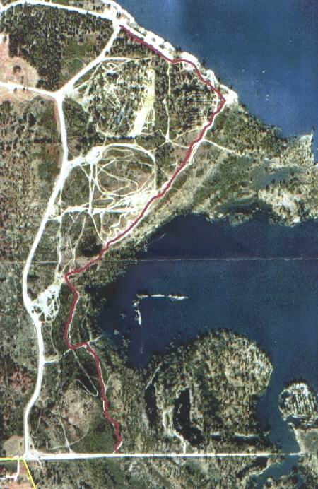 1978 Ford Bronco - This aerial map displays a marked route through a forested landscape adjacent to a large lake.