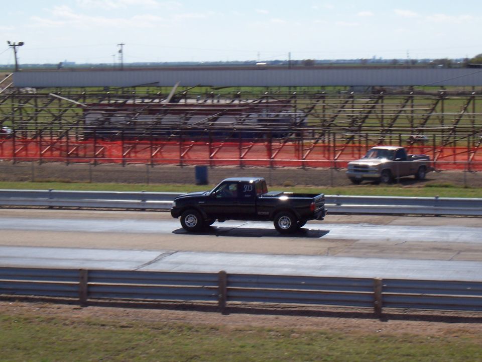 2003 Ford Ranger and another pickup truck on a drag strip