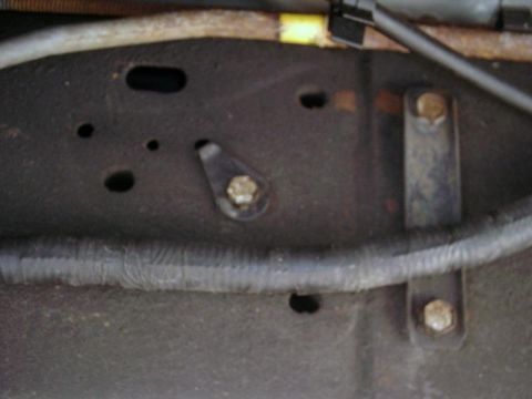 1997 Ford F-150 - Detail of a truck frame, including a wiring harness and mounting hardware. Supermotors.net logo is present.