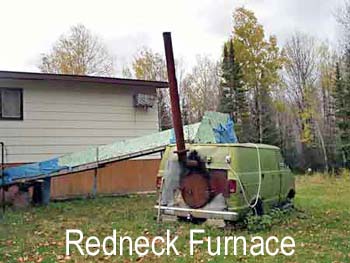 1988 Ford Bronco - A green van is parked in a yard with a tall pipe extending upwards from its rear.