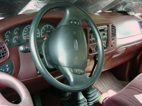 1997 Ford F-150 - Interior view of a 1997 Ford F-150, highlighting the dashboard and steering wheel.