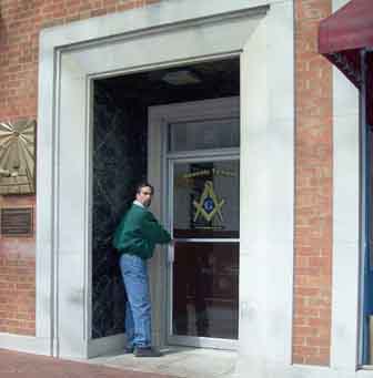 1971 Ford Ranchero - A man stands in the entrance of a building displaying the Square and Compasses emblem of Freemasonry.