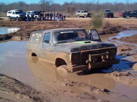 1978 Ford Bronco - This 1978 Ford Bronco is deeply stuck in a muddy mire, with its front end submerged.