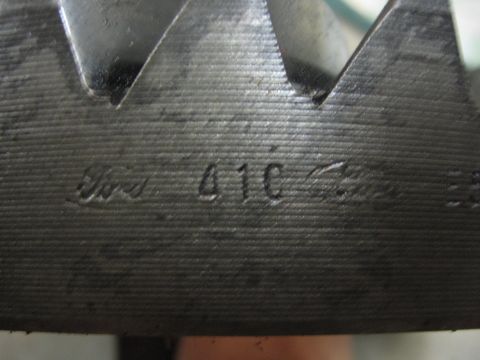 1974 Ford F-100 - A close-up view of a metal gear, clearly stamped with "Ford 410" and other markings.