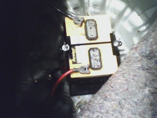 1993 Ford Probe - Close-up of two car batteries with visible wiring and SuperMotors.net logo.