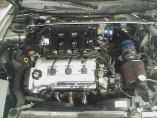 1993 Ford Probe - Engine bay view showing engine components and aftermarket modifications.