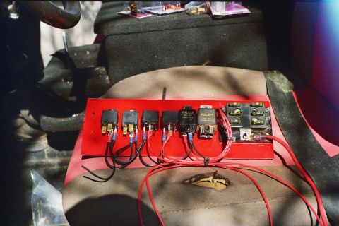 1978 Ford Bronco - A custom-mounted fuse box and relay panel is visible inside a vehicle.