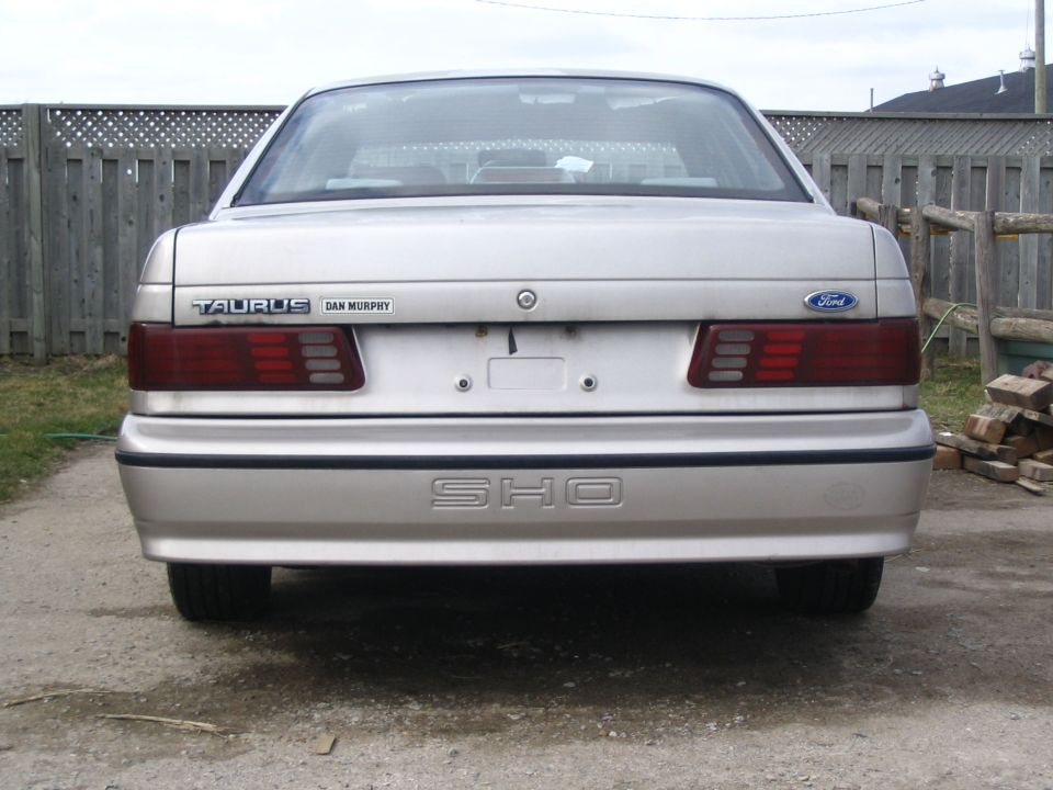 Rear of a silver Ford Taurus SHO with 'TAURUS' and 'DAN MURPHY' badges