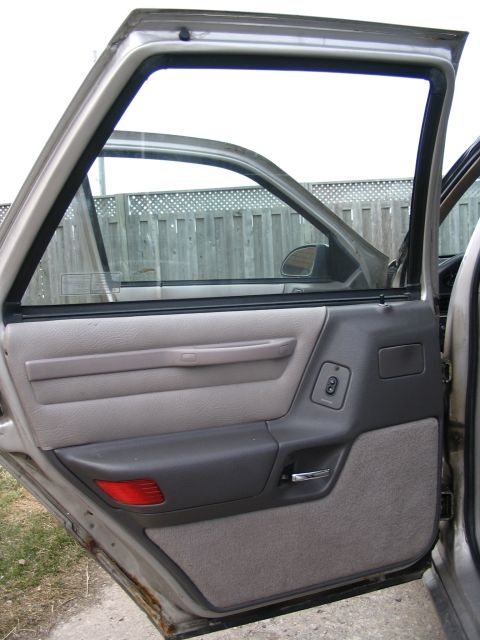 1993 Ford Taurus - The interior door panel and window controls are visible, suggesting an older model year than claimed.