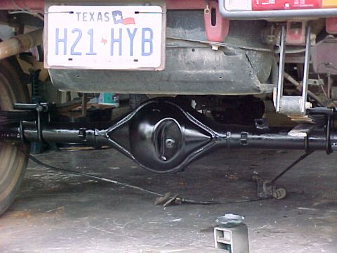 1978 Ford Bronco - Close-up view of a vehicle's rear axle and a Texas license plate.