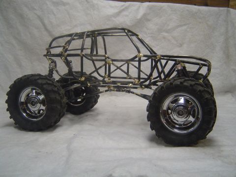 1993 Ford Bronco - Custom tube frame chassis with large off-road tires and suspension, ready for bodywork.