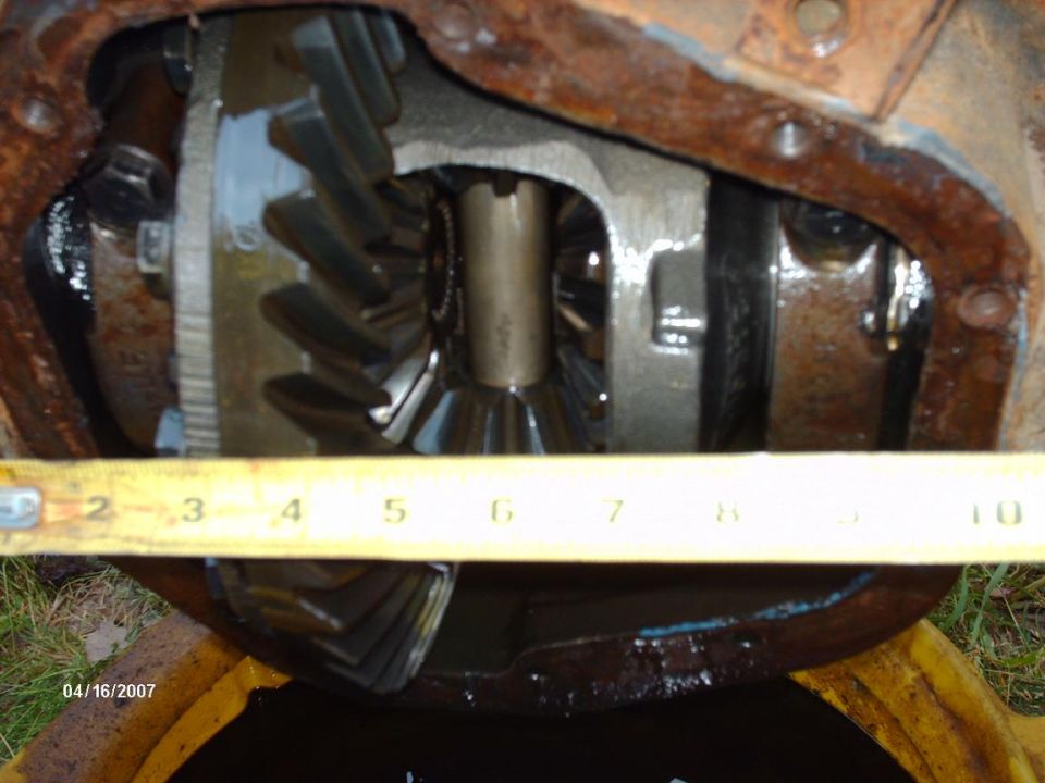 Close-up of differential gears with a tape measure across them