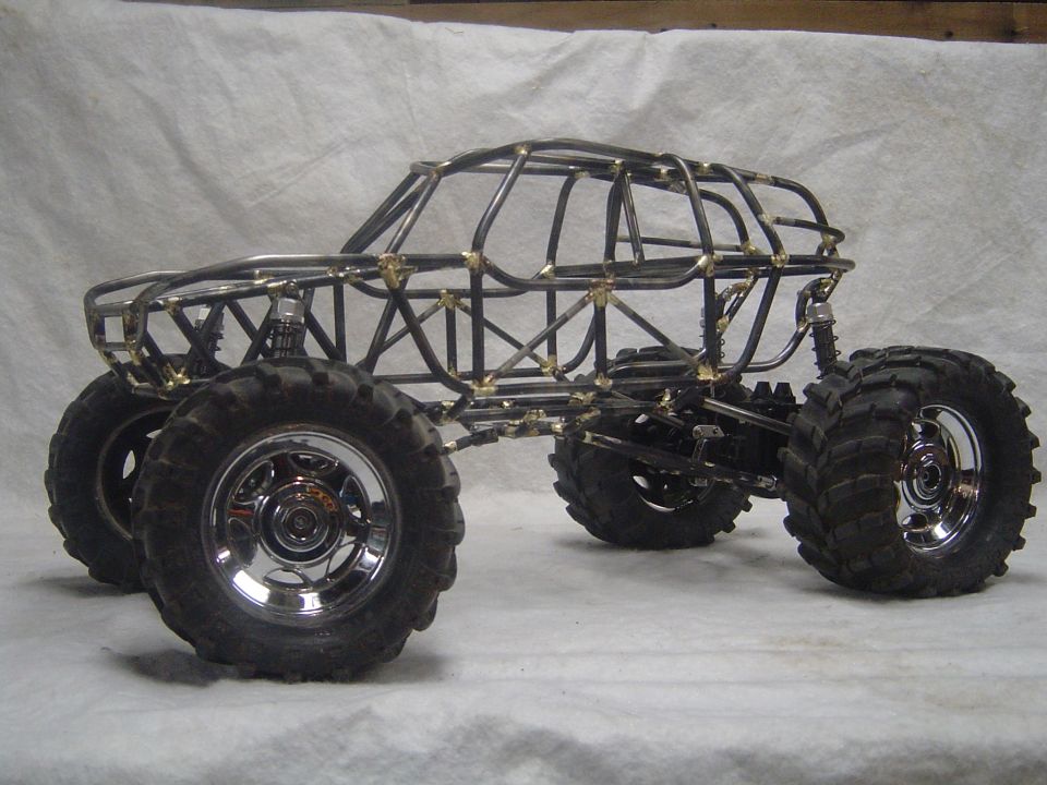 Custom tube chassis rock crawler with large tires and chrome rims