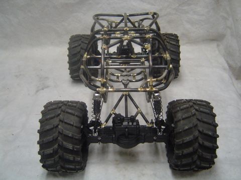 1993 Ford Bronco - This custom RC rock crawler features a detailed tube chassis and massive tires, ready for off-road action.
