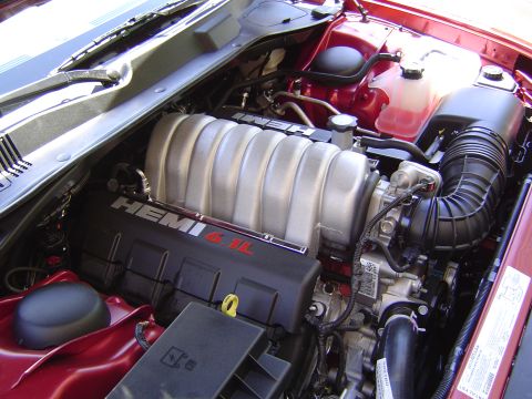 2006 Dodge Charger - The engine bay of a 2006 Dodge Charger displays its HEMI 6.1L engine, complete with intake and coolant systems.