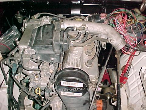 1978 Ford Bronco - Close-up of a vehicle's engine bay, showing intricate wiring and engine components.