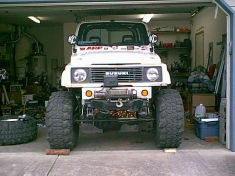 1978 Ford Bronco - This Suzuki Samurai is equipped with large off-road tires and a front-mounted winch, suggesting it is modified for terrain.