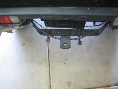 1987 Suzuki Samurai - Close-up view of a vehicle's rear bumper and trailer hitch assembly.