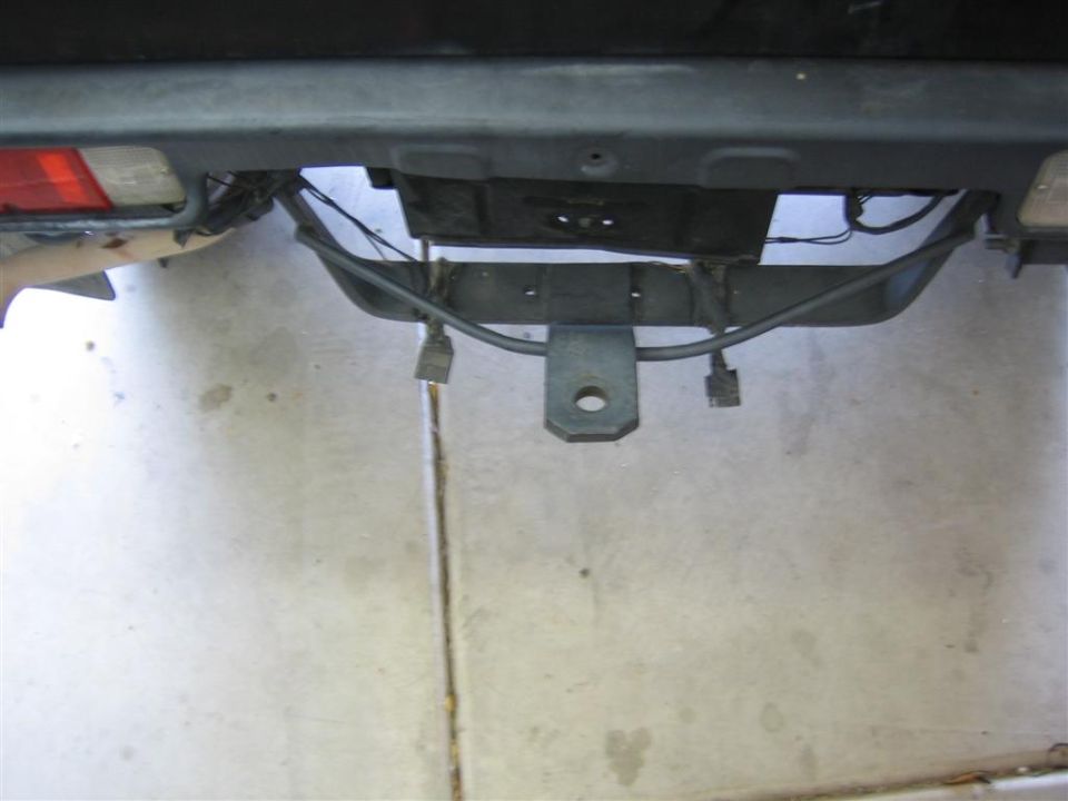 Rear bumper assembly with trailer hitch and wiring connectors