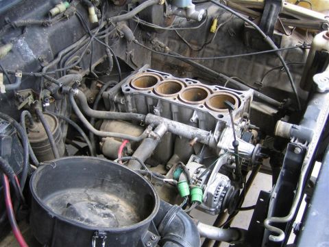 1987 Suzuki Samurai - The engine block is disassembled, revealing the cylinders and internal components.