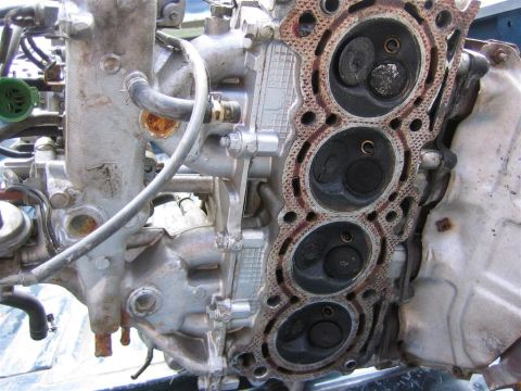 1987 Suzuki Samurai - Engine cylinder head showing the combustion chambers and valves.