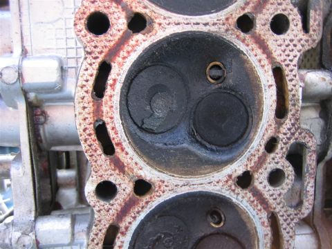 1987 Suzuki Samurai - This is a close-up view of an engine's cylinder head, showing the combustion chambers and valves.