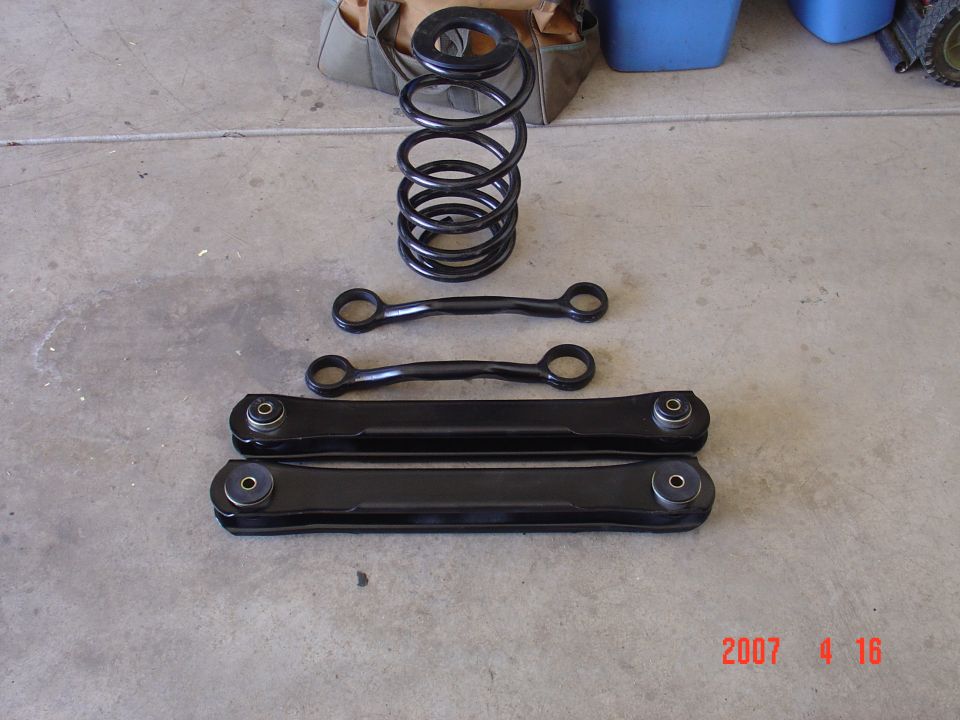 the lower controle arms with the bushings pressed in, new springs