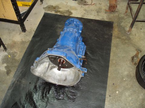 1984 Ford Bronco - Transmission assembly on a mat, likely for a rebuild or repair.