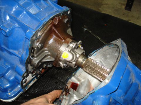 1984 Ford Bronco - Close-up view of a disassembled transmission, showing internal components and a splined shaft.
