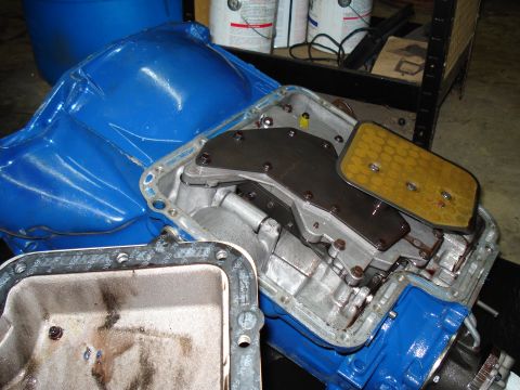 1984 Ford Bronco - Automatic transmission pan removed, exposing internal components and filter.