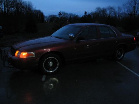 2001 Ford Crown Victoria - A 2001 Ford Crown Victoria is seen from the front quarter angle at dusk.
