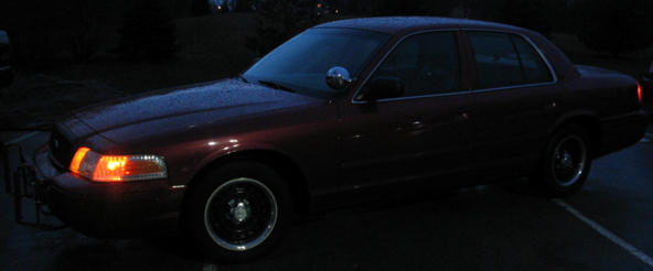 Dark red 2001 Ford Crown Victoria sedan, 3/4 front view