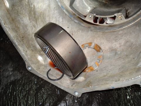 1984 Ford Bronco - A transmission gear and washer are shown removed from the transmission housing.