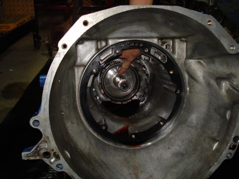 1984 Ford Bronco - Close-up view of a transmission torque converter assembly, showing internal components and some fluid residue.
