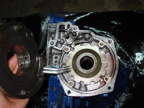 1984 Ford Bronco - Close-up of a disassembled transmission pump, showing internal gears and mechanisms.