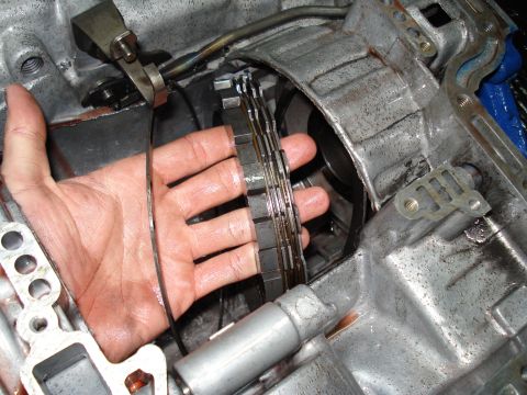 1984 Ford Bronco - Transmission clutch pack plates being held during a rebuild process.