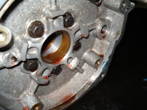 1984 Ford Bronco - This image shows the interior of a transmission housing, revealing a bearing and traces of fluid.
