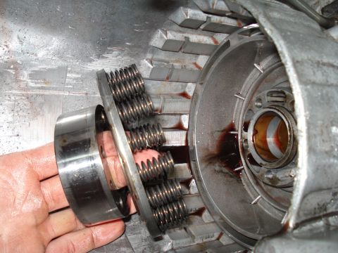 1984 Ford Bronco - A close-up view of a transmission clutch pack assembly, revealing its internal components and fluid.