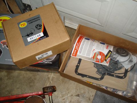 1984 Ford Bronco - A transmission rebuild kit is shown, including a TCI Performance Components box and a gasket set with instructions and a CD.