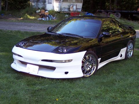 1995 Ford Probe - This modified sports car features a two-tone paint scheme and custom bodywork.
