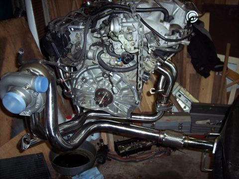 1995 Ford Probe - Engine with turbo and custom exhaust manifold, likely for a performance build.