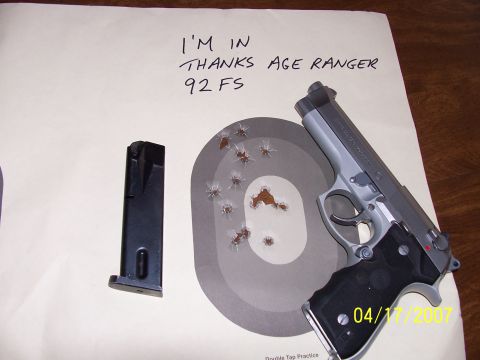 2000 Nissan Xterra - A pistol and its magazine rest on a target, showing evidence of recent shooting practice.
