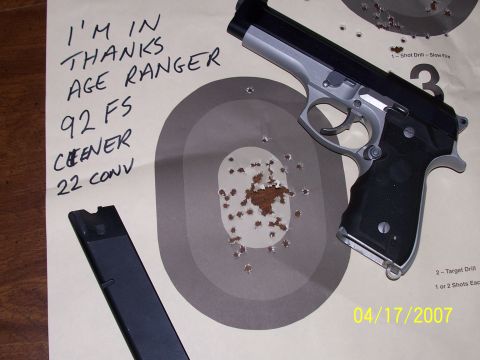 2000 Nissan Xterra - Pistol and target with handwritten notes and SuperMotors logo visible.