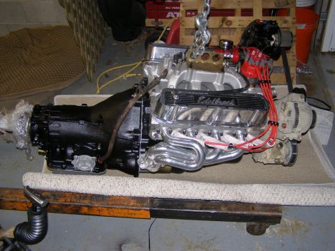 1993 Ford Bronco - A V8 engine and automatic transmission are prepared for installation, chrome headers and an Edelbrock intake manifold.