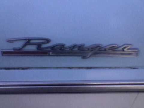1969 Ford F-250 - Close-up of a Ford Ranger emblem on a vehicle's exterior.
