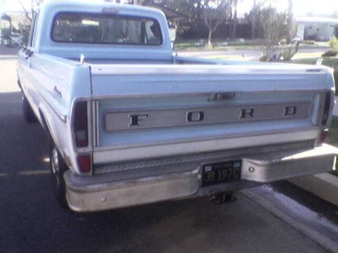 1969 Ford F-250 - Rear view of a 1969 Ford F-250 pickup truck, its distinctive tailgate lettering and a visible license plate.