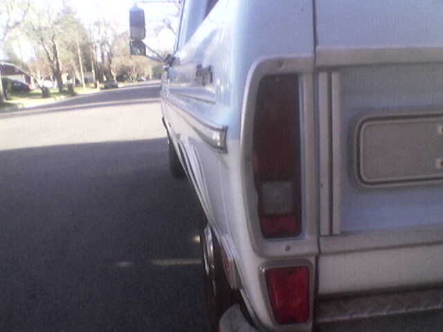 Rear quarter panel and taillight of a 1967 Ford F-series truck
